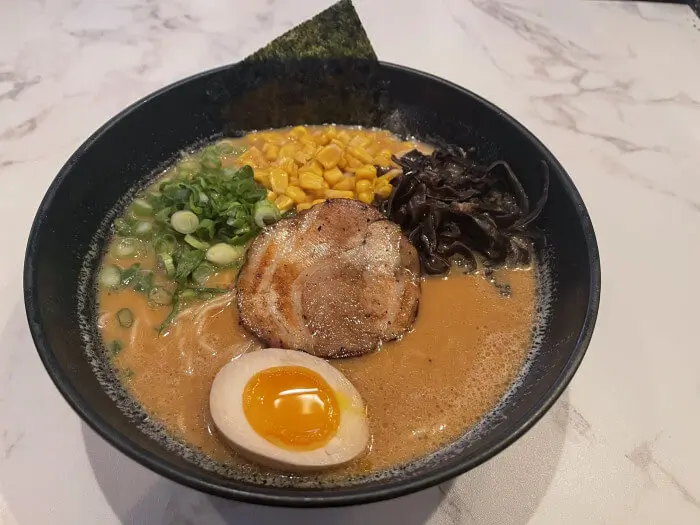 Miso Ramen - Miso - flavored ramen with a slice of roasted pork, corn, and green onions at Ramen Jin, a Ramen restaurant in Houston