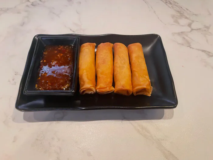 Vegetable Spring Roll - Crispy vegetable - filled spring rolls served with a spicy dipping sauce at Ramen Jin, a Ramen restaurant in Houston