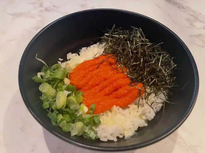 Fish Roe Donburi - Fresh fish roe, green onions, and seaweed strips on top of white rice at Ramen Jin, a Ramen restaurant in Houston